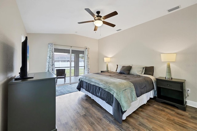 bedroom featuring ceiling fan, dark hardwood / wood-style flooring, access to exterior, and vaulted ceiling