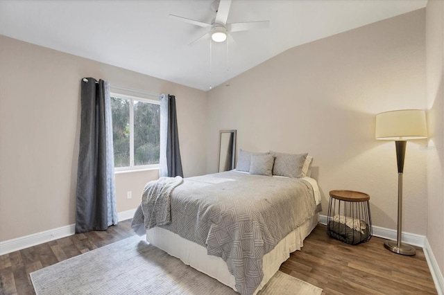 bedroom featuring dark wood-type flooring, ceiling fan, and lofted ceiling