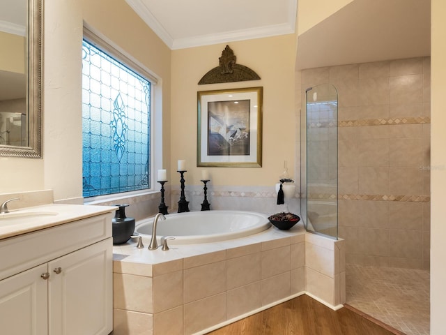 bathroom with vanity, wood-type flooring, crown molding, and independent shower and bath