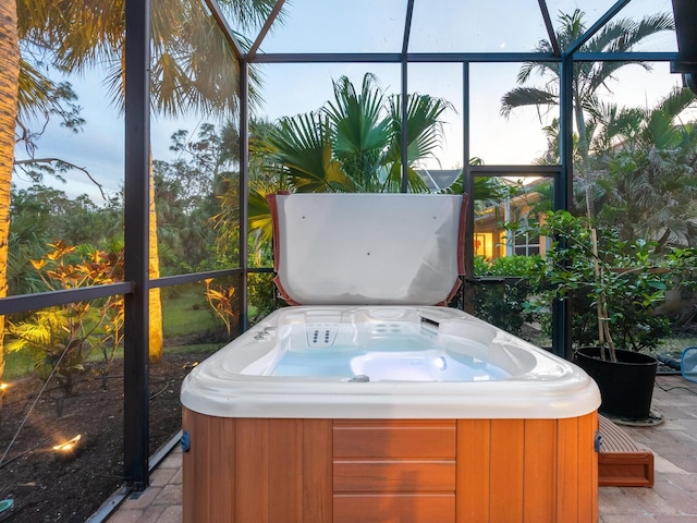 sunroom with a hot tub