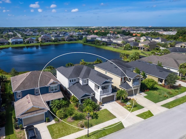 drone / aerial view with a water view