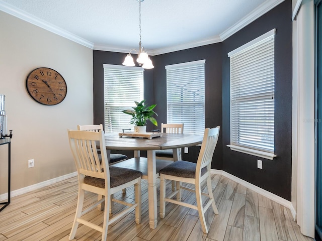 dining space with an inviting chandelier and ornamental molding