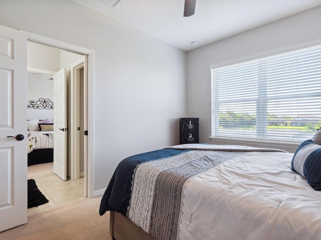 bedroom featuring light carpet and ceiling fan