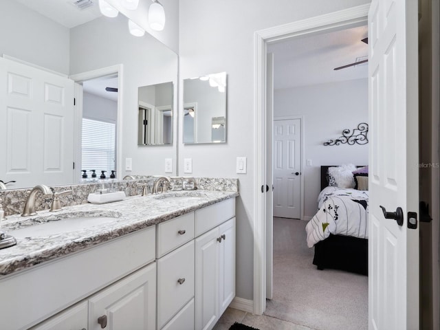 bathroom featuring ceiling fan and vanity