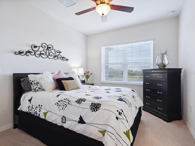 bedroom with light colored carpet and ceiling fan