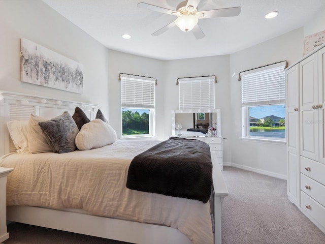 carpeted bedroom with ceiling fan