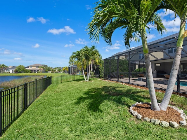 view of yard with glass enclosure