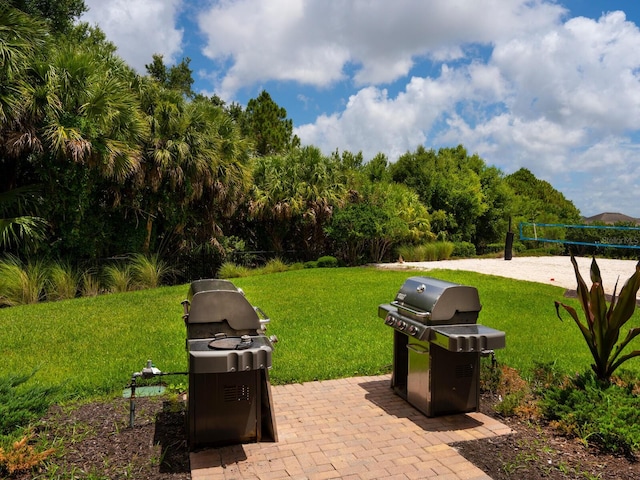 view of patio featuring area for grilling and volleyball court