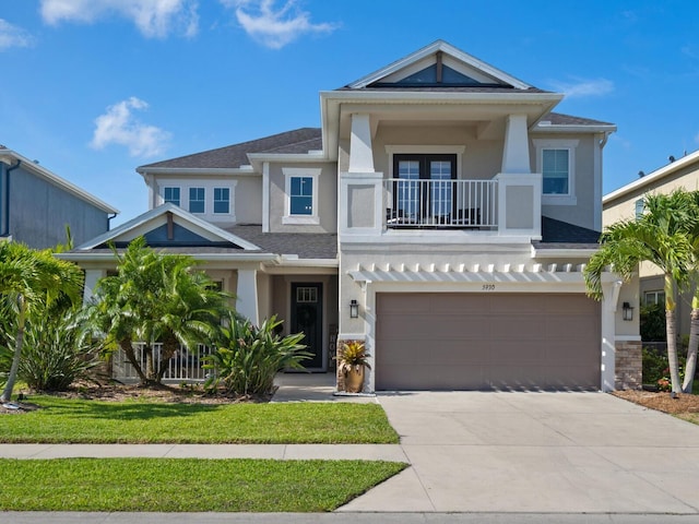 5930 Anise Dr, Sarasota, FL 34238 - craftsman-style home featuring stone siding, concrete driveway, a garage, a balcony, and stucco siding