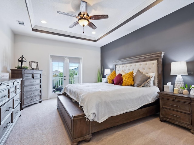 5930 Anise Dr, Sarasota, FL 34238 - bedroom featuring a tray ceiling, access to exterior, recessed lighting, light colored carpet, and ceiling fan