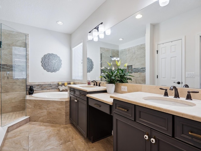 5930 Anise Dr, Sarasota, FL 34238 - full bath featuring a bath, a shower stall, two vanities, and a sink