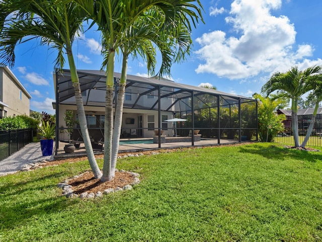 5930 Anise Dr, Sarasota, FL 34238 - back of house with a fenced in pool, fence, a yard, a patio area, and a lanai