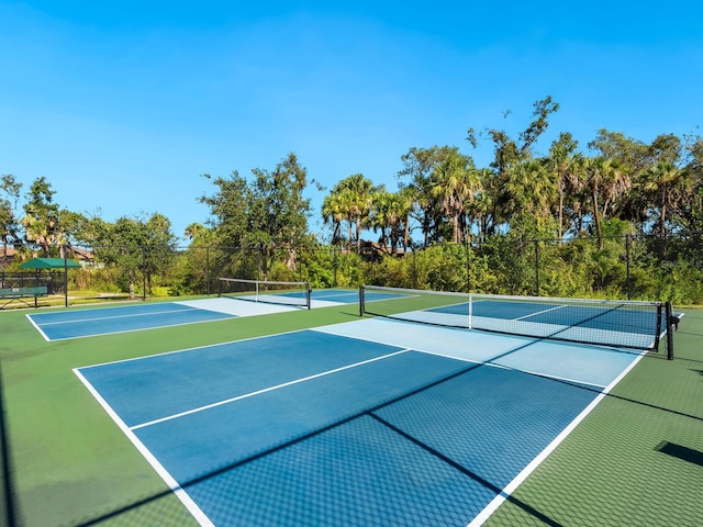 view of sport court featuring basketball hoop