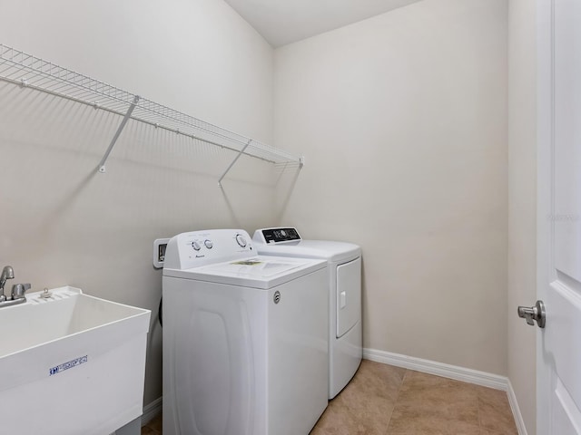 laundry area with sink and washer and dryer