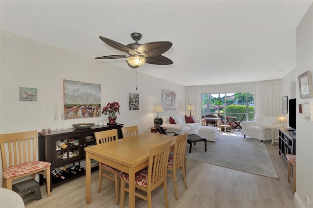 dining space featuring ceiling fan and light hardwood / wood-style floors