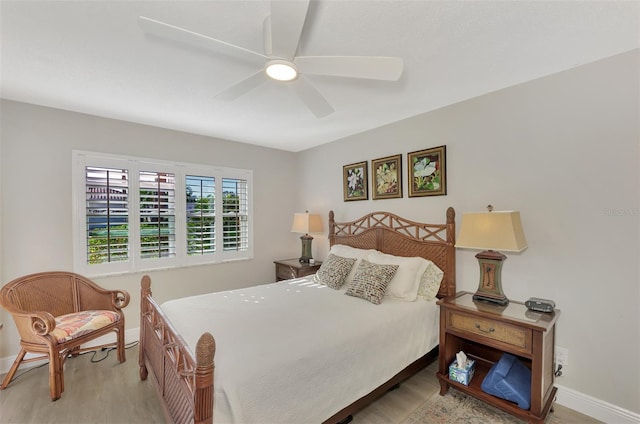 bedroom with ceiling fan and light hardwood / wood-style floors