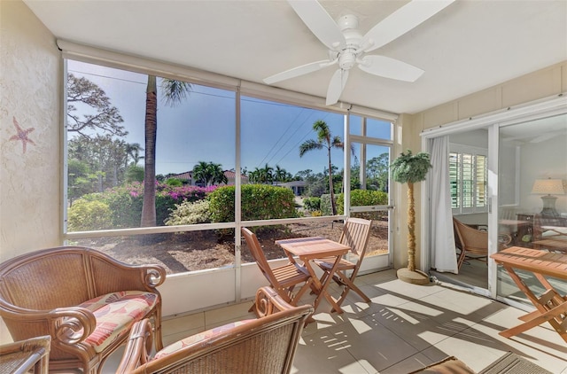 sunroom featuring ceiling fan