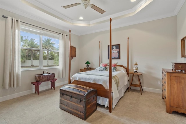 bedroom with ceiling fan, ornamental molding, and a tray ceiling