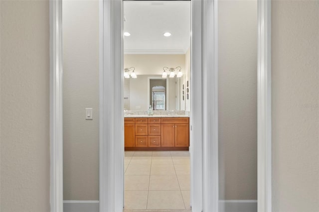 bathroom with vanity, tile patterned floors, and ornamental molding