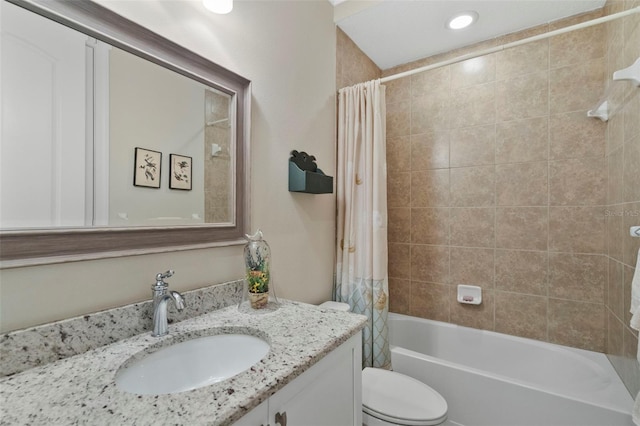 full bathroom with shower / bath combo, vanity, and toilet