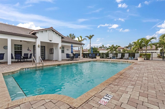 view of swimming pool featuring a patio