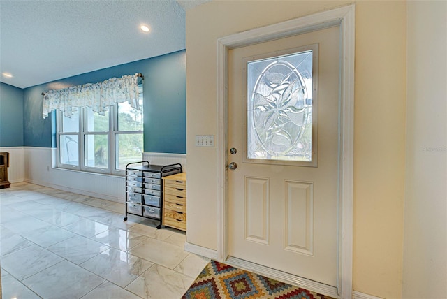 foyer featuring a textured ceiling