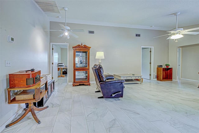 sitting room featuring lofted ceiling