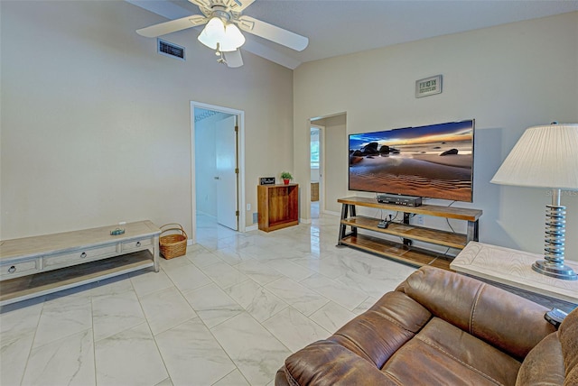 living room with ceiling fan and lofted ceiling