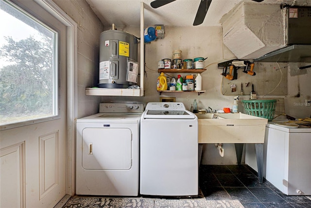 laundry area featuring washer and clothes dryer, plenty of natural light, ceiling fan, and electric water heater