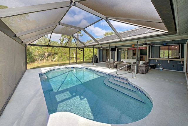 view of swimming pool featuring outdoor lounge area, ceiling fan, and a patio