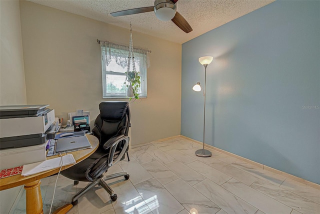 home office with ceiling fan and a textured ceiling