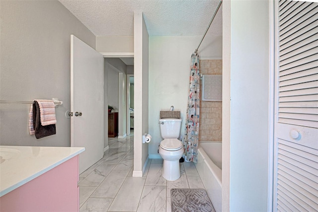 full bathroom featuring shower / bath combination with curtain, vanity, a textured ceiling, and toilet