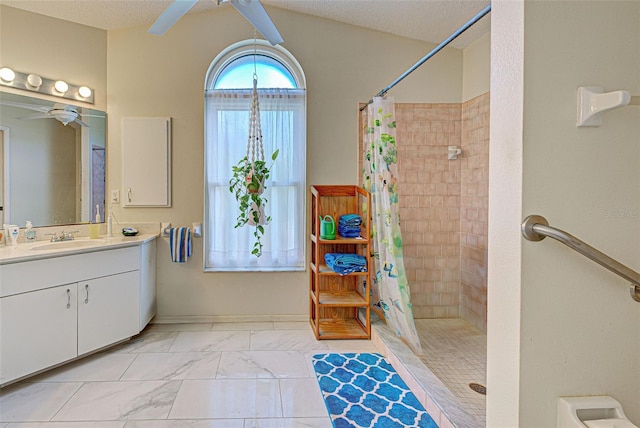 bathroom featuring vanity, a textured ceiling, and walk in shower