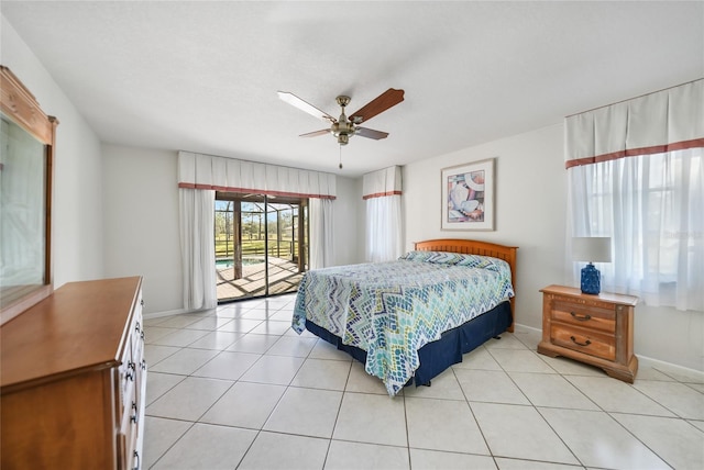 bedroom with access to exterior, ceiling fan, and light tile patterned flooring