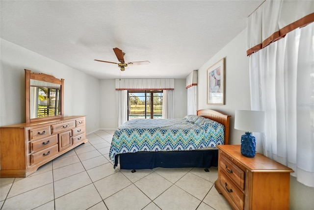 bedroom with ceiling fan and light tile patterned floors