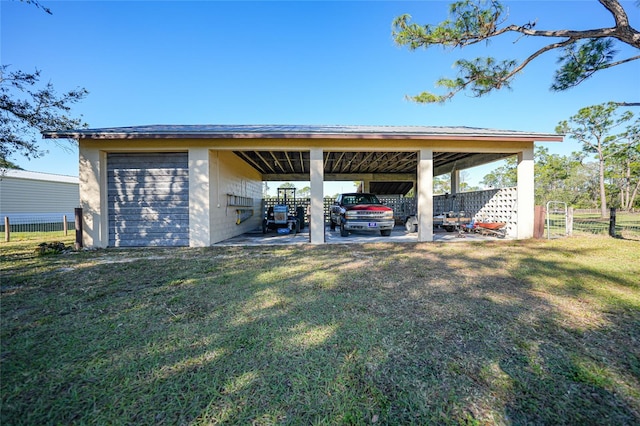 exterior space featuring a lawn and a carport