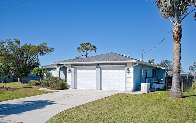 ranch-style home with a front yard and a garage