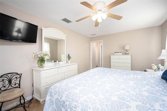 bedroom featuring ceiling fan and carpet