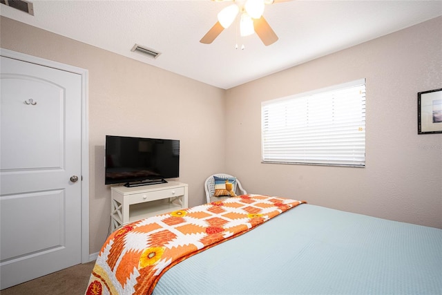 carpeted bedroom featuring ceiling fan