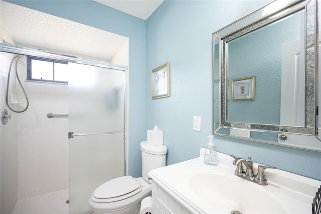 bathroom with walk in shower, vanity, toilet, and a textured ceiling