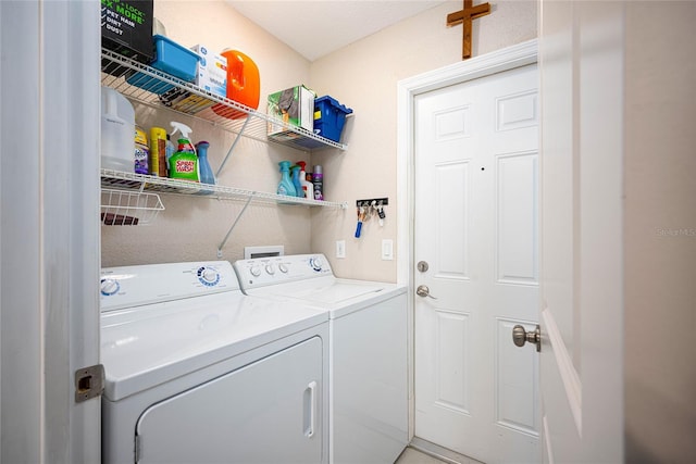 laundry room featuring washer and clothes dryer