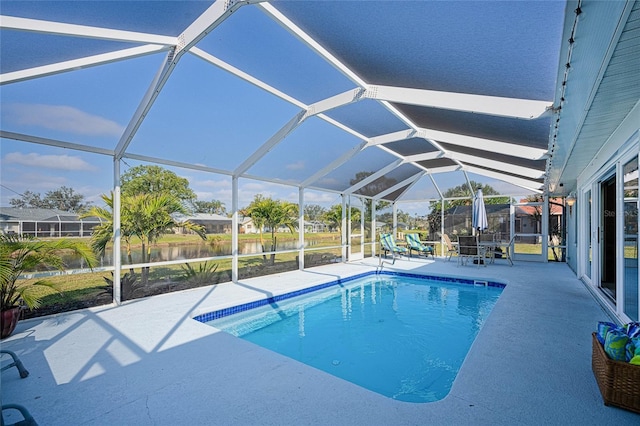 view of swimming pool with a lanai and a patio area