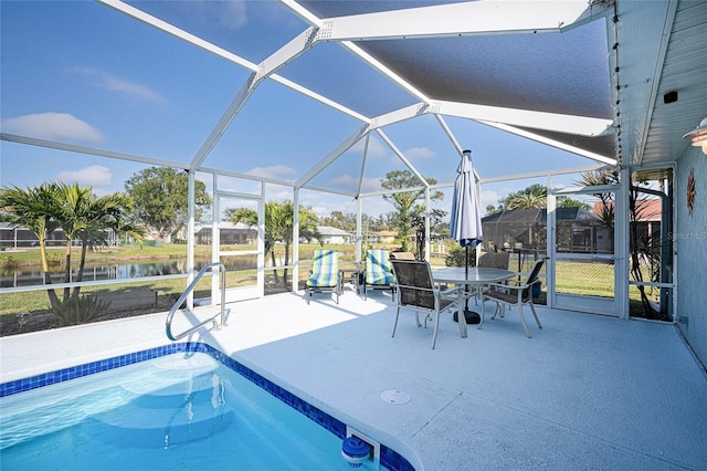 view of pool featuring a lanai, a water view, and a patio