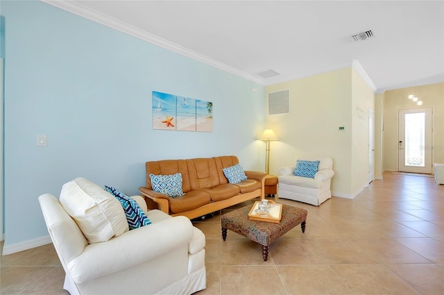 living room featuring a chandelier, ornamental molding, and light tile patterned flooring