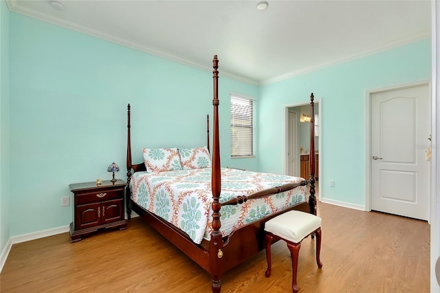 bedroom with light wood-type flooring and ornamental molding