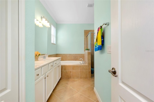 bathroom with tile patterned flooring, shower with separate bathtub, and vanity