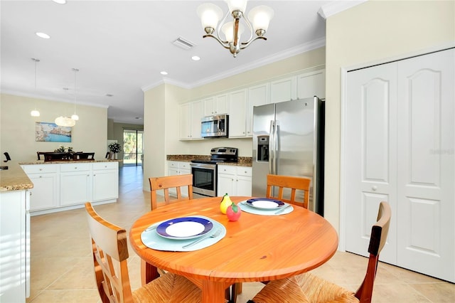 dining area with crown molding, light tile patterned floors, and an inviting chandelier