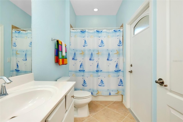 full bathroom featuring tile patterned floors, vanity, toilet, and shower / bath combo