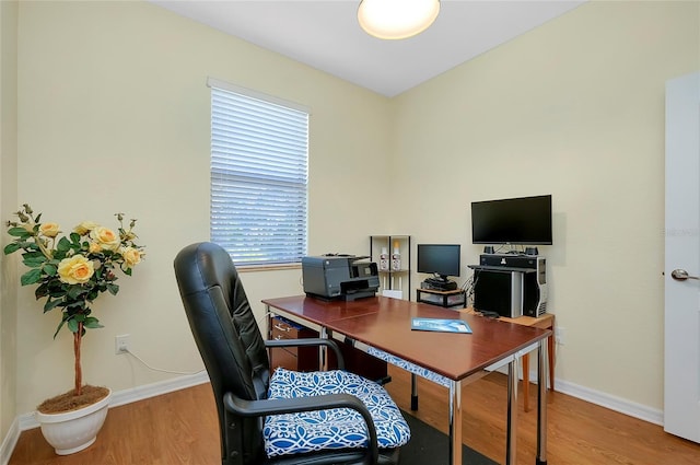 office area with hardwood / wood-style floors and plenty of natural light