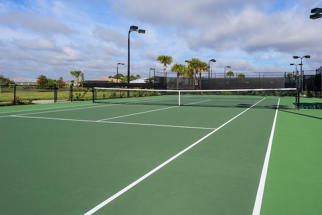 view of sport court with basketball hoop